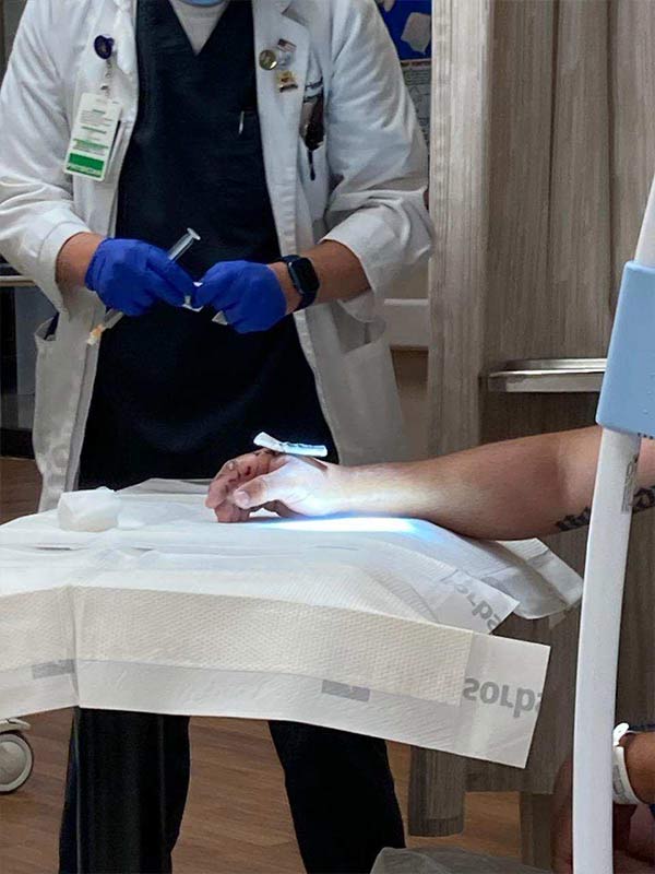 doctor getting ready to remove the stingray