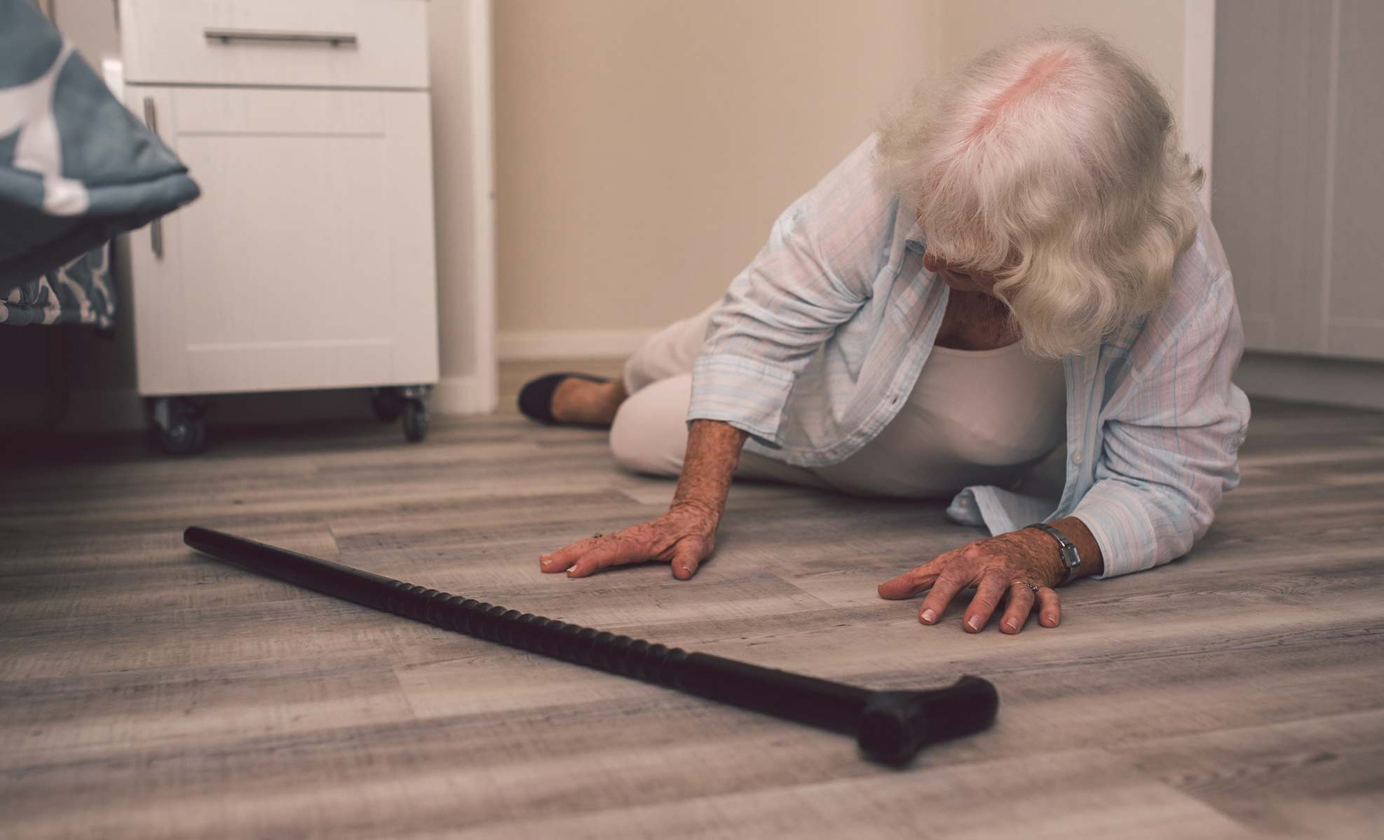 senior woman on the floor after falling