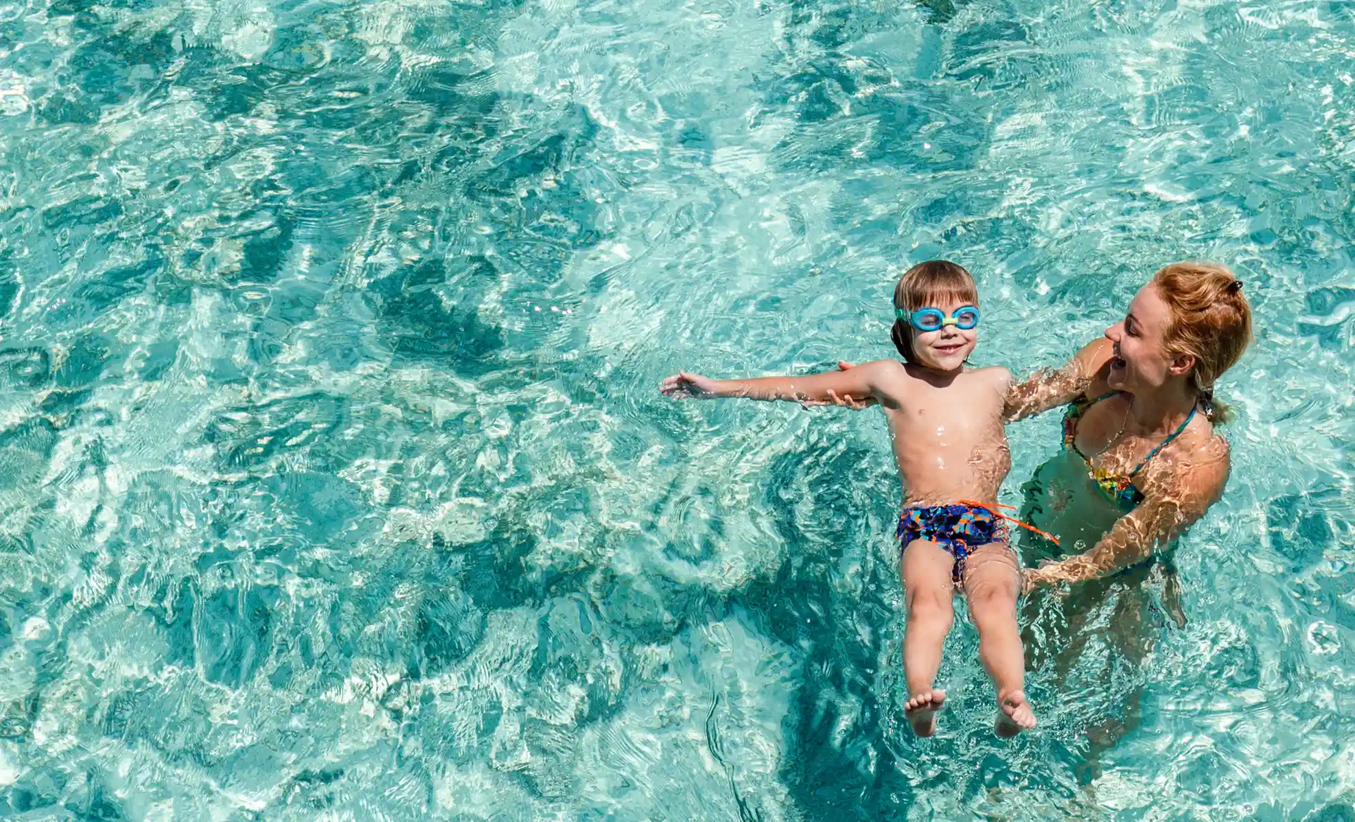 mom and son in pool