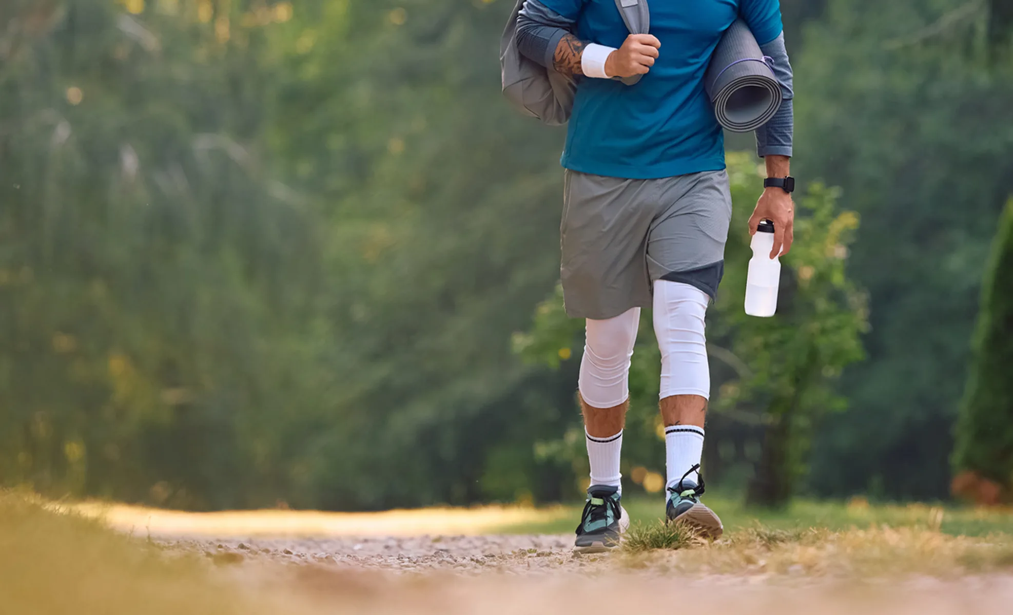 Athlete walking down a trail Athlete walking down a trail