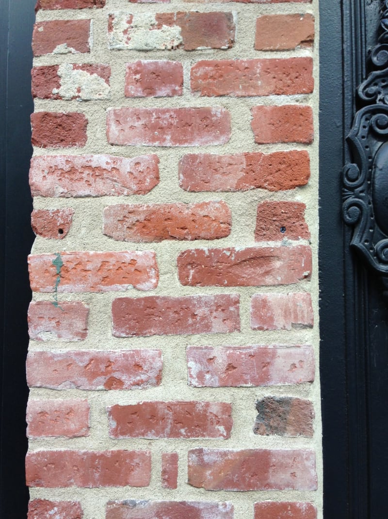 The holes in the wall show where the plaque was once mounted.