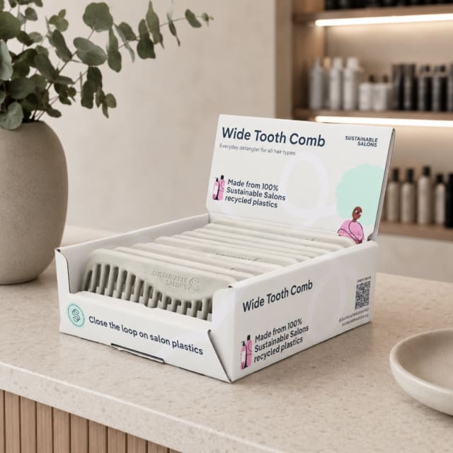 Box of cream combs on counter