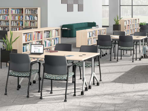 A multi-media center setting featuring SoCo seating, Ignition guest chairs, and Motivate tables.