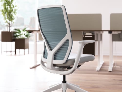 Flexion task chair with height adjustable workstations in background.