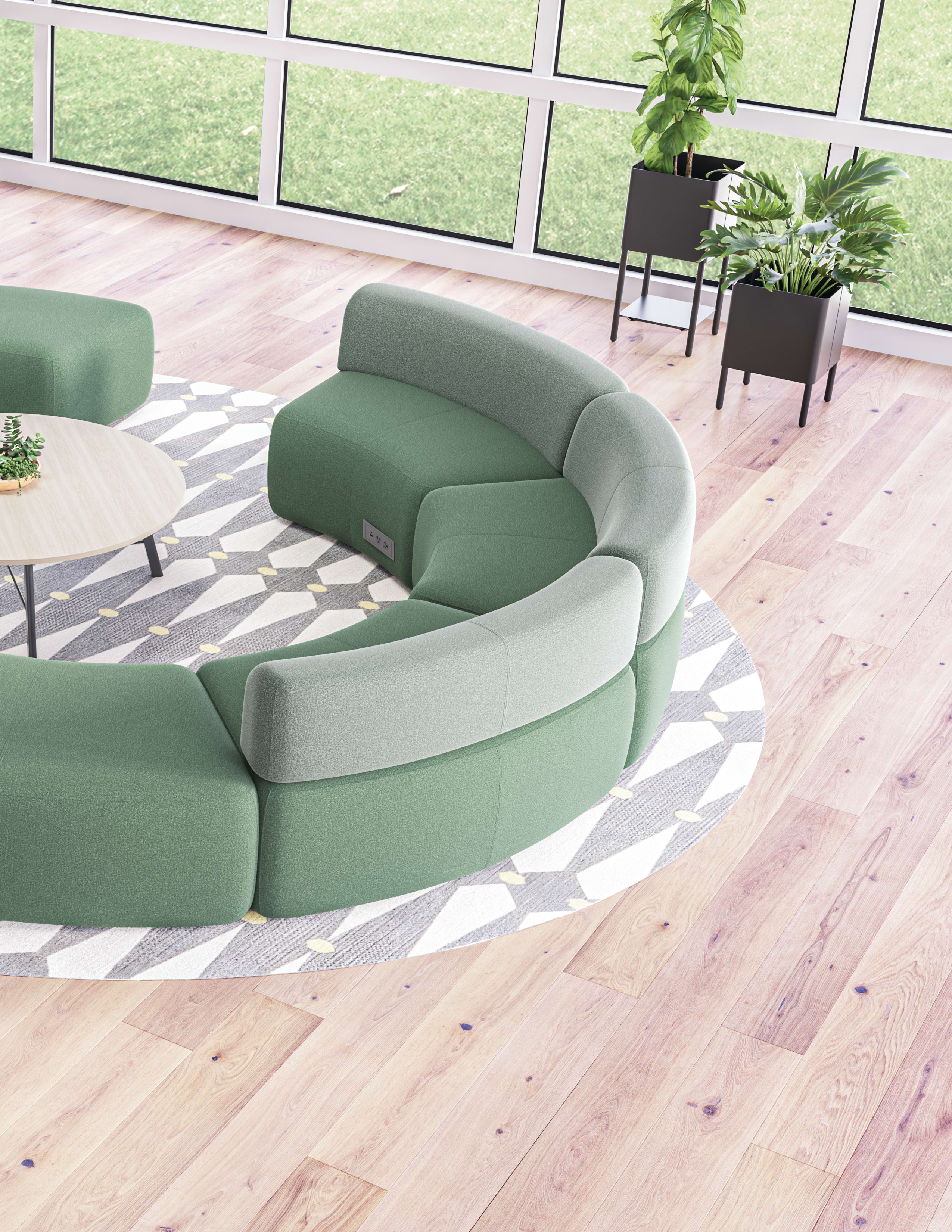 SoCo multi-fabric modular lounge in collaborative area with Scramble table and Sculpt planters near Empower workstations.