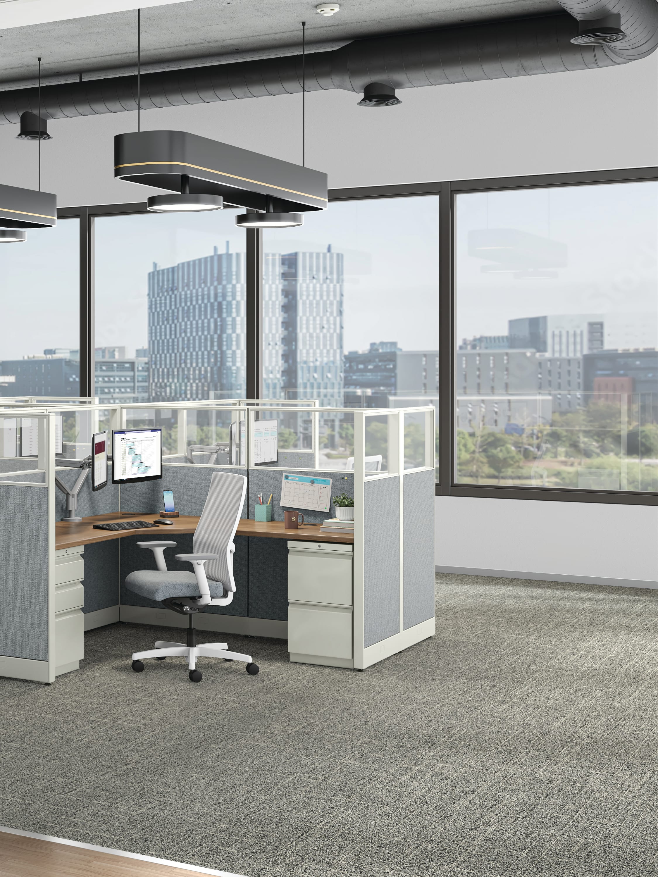 Accelerate workstations shown with Ignition task chairs and Brigade storage.
