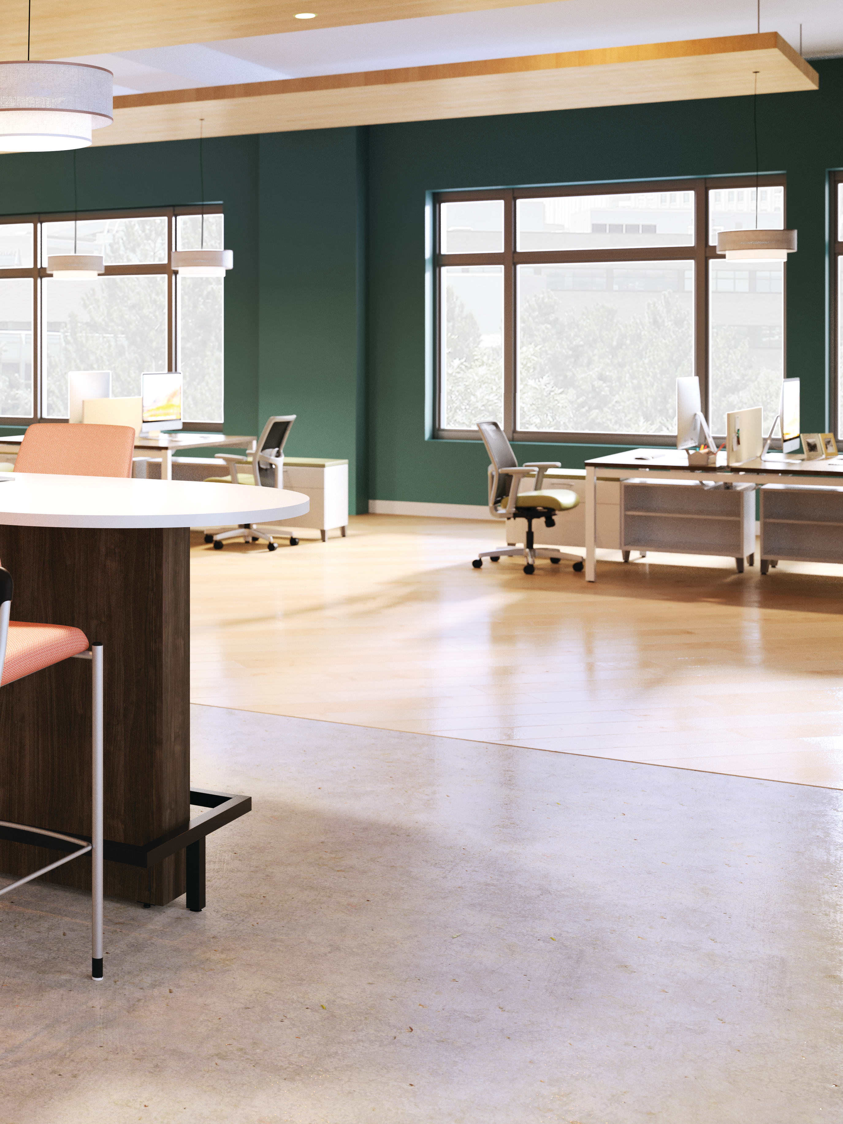 Preside team touchdown table with Ignition chairs in an open floor plan shown with TV mount and at standing height