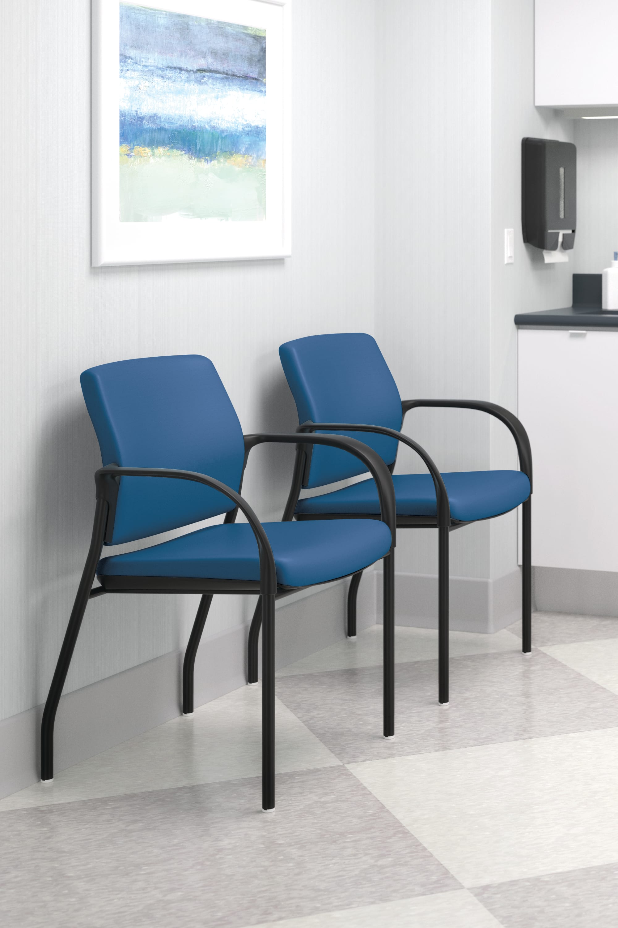 Ignition multi-purpose chairs in SX01 Silvertex Marine Blue, black frame. Exam stool in EA Black vinyl, polished frame.-