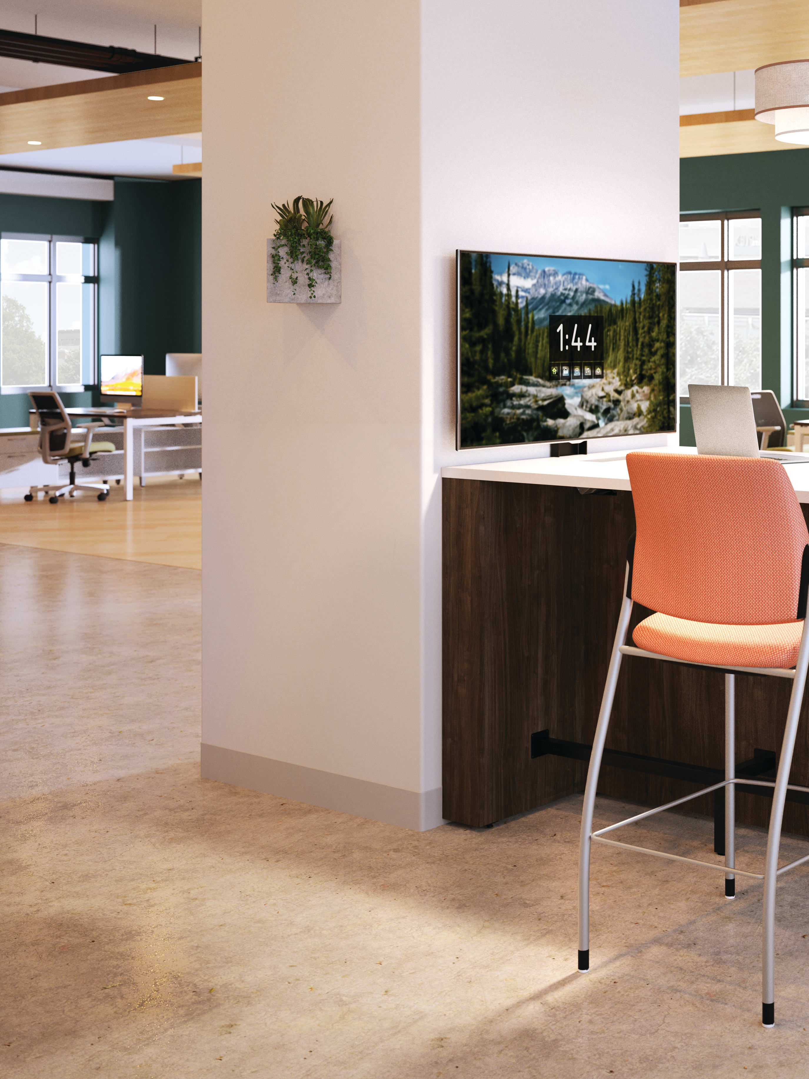 Preside team touchdown table with Ignition chairs in an open floor plan shown with TV mount and at standing height