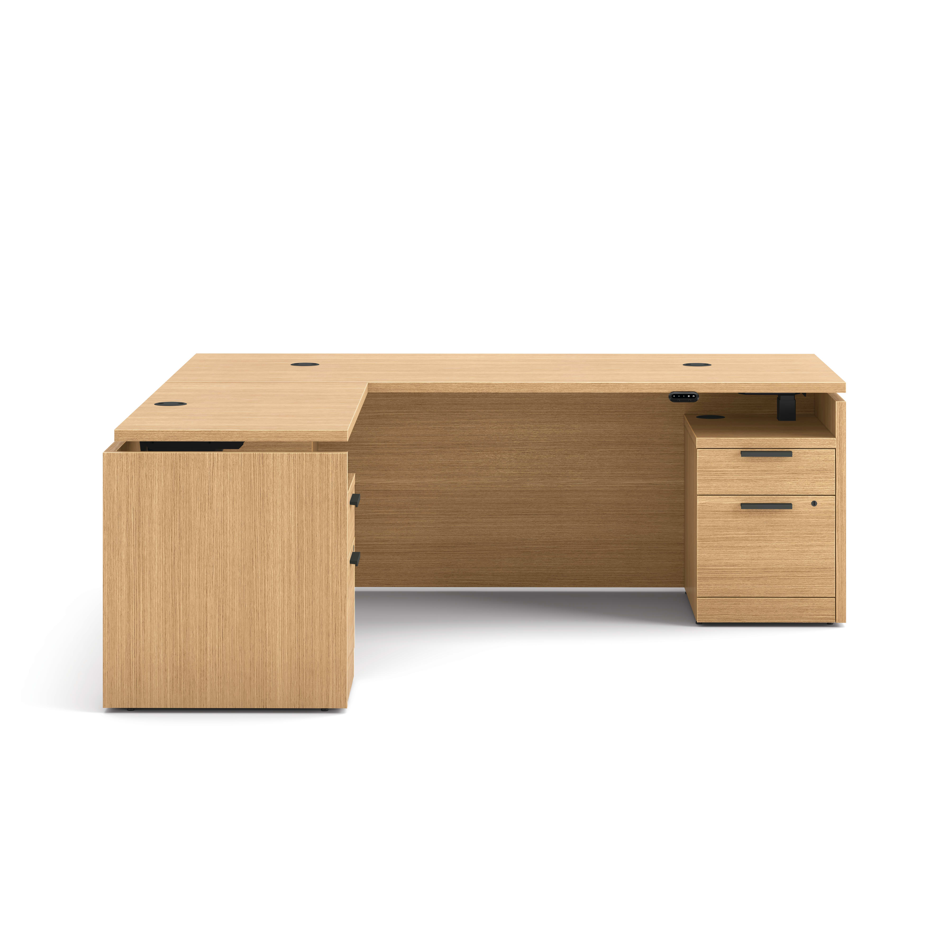 L-shaped executive workstation with woodgrain finish, integrated power access, and pedestal file storage.
