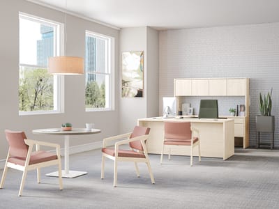 Confer guest chairs with Birk Round Top with Knife Edge and working lounge-height single pedestal.