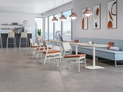 Confer guest chairs with Birk working lounge-height pedestal and Birk round top table. Paired with Astir two-seat lounge and Sculpt planter.