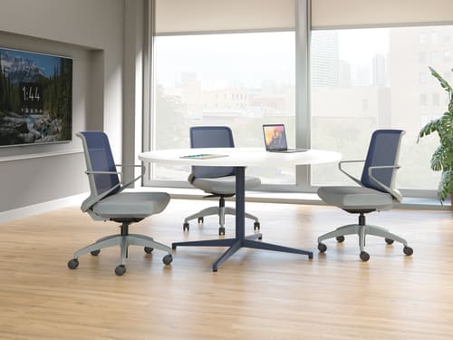 Cliq chairs with Preside round conference table.