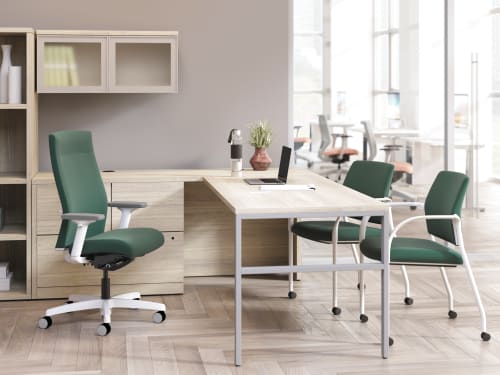 Ignition upholstered chair at 10500 Series L-shaped desk with 2 guest chairs.