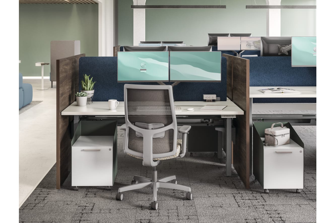 HON Empower workstations with Ignition seating adjacent to a touchdown collaborative space.
