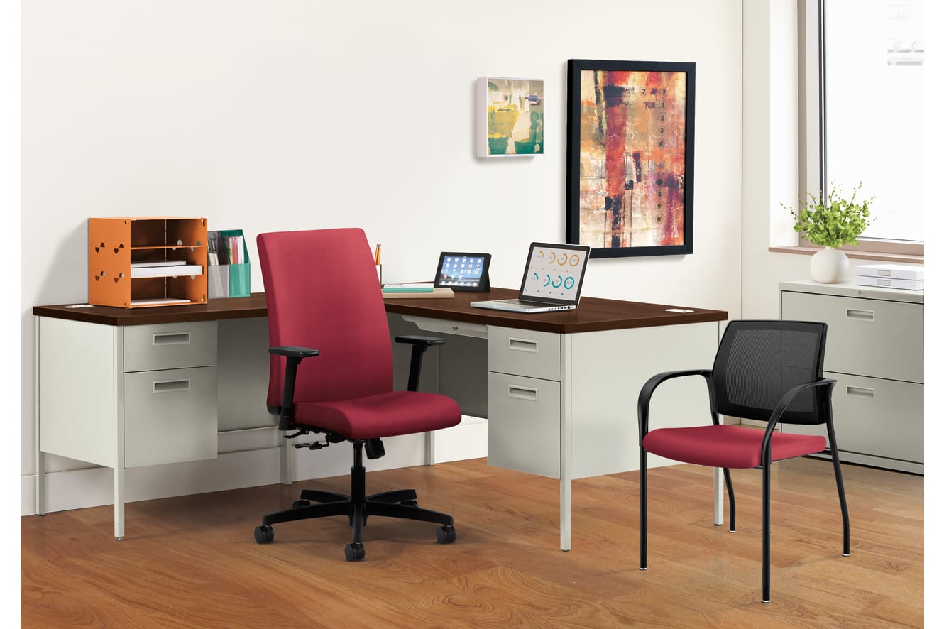 A modern and organized home office space with a wooden desk, shelves, and various office equipment and decor elements.