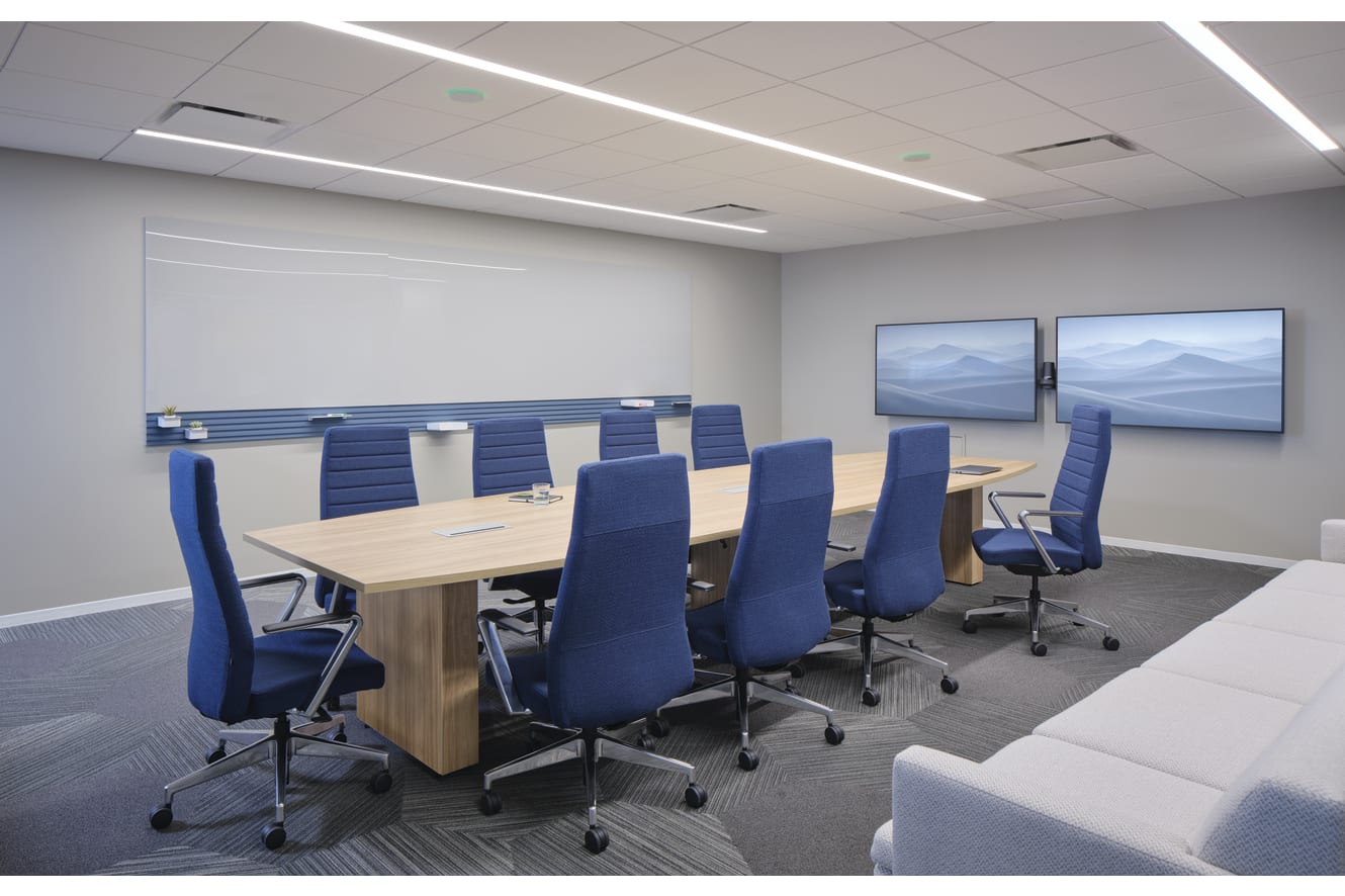 Preside conference table with Cofi task chairs,  Workwall markerboard tiles, and Astir