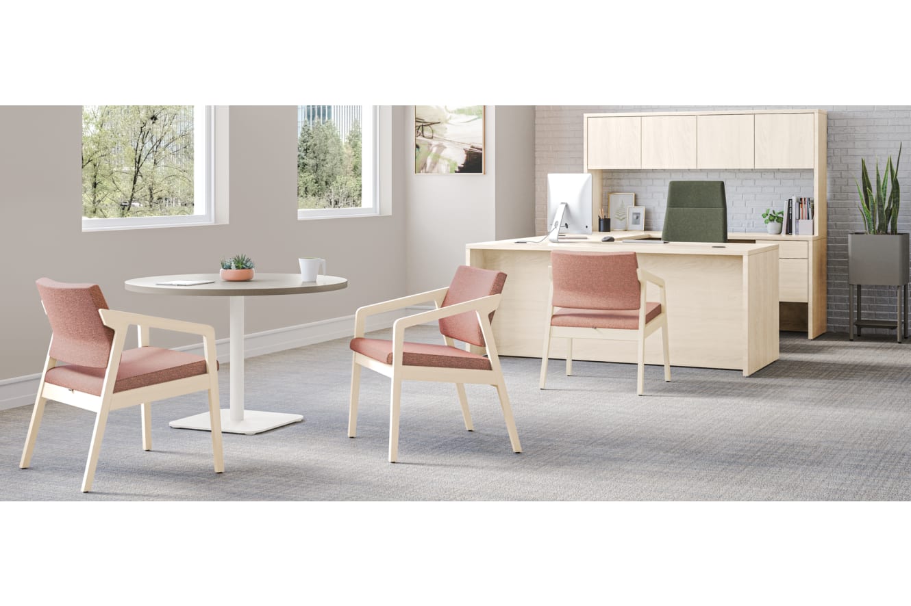 Confer guest chairs with Birk Round Top with Knife Edge and working lounge-height single pedestal.