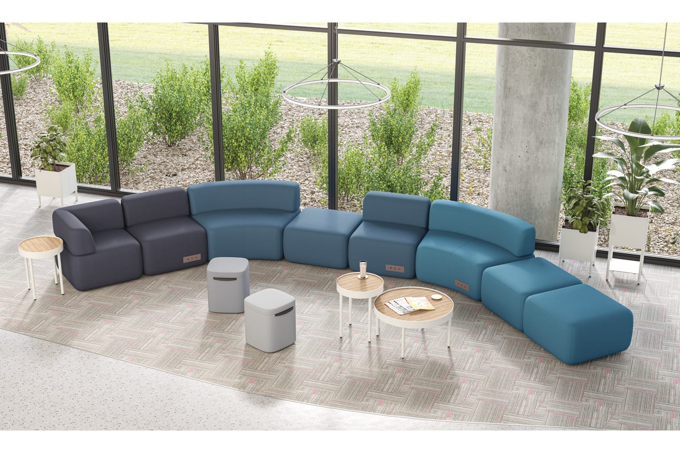 SoCo modular lounge in public space with Sculpt occasional tables & planters and Astir poufs.