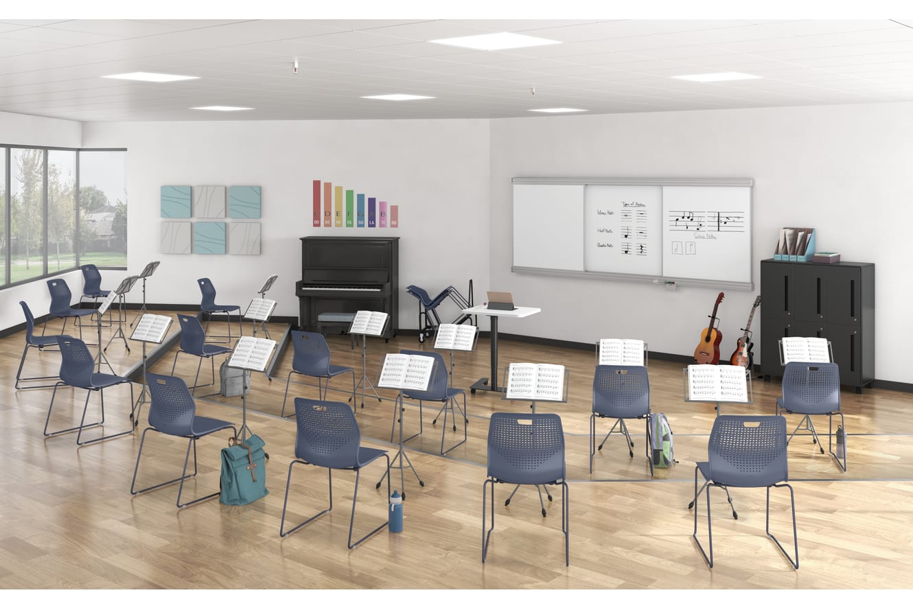 School music room with blue Etch wire frame chairs and a Roll Call teacher's lectern.