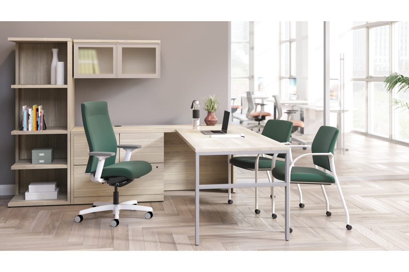 Ignition upholstered chair at 10500 Series L-shaped desk with 2 guest chairs.