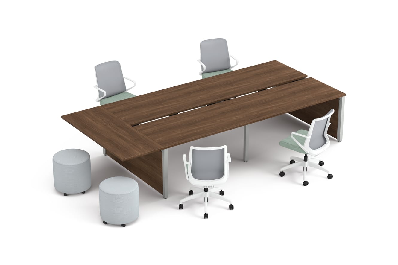 Four ergonomic office chairs around two connected rectangular desks with wooden tops, accompanied by two round upholstered stools.
