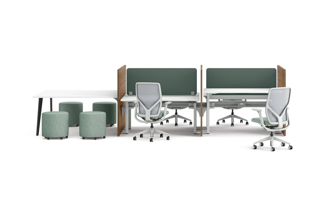 Two workstations with green fabric privacy panels, ergonomic office chairs, and a side table with four round upholstered stools.