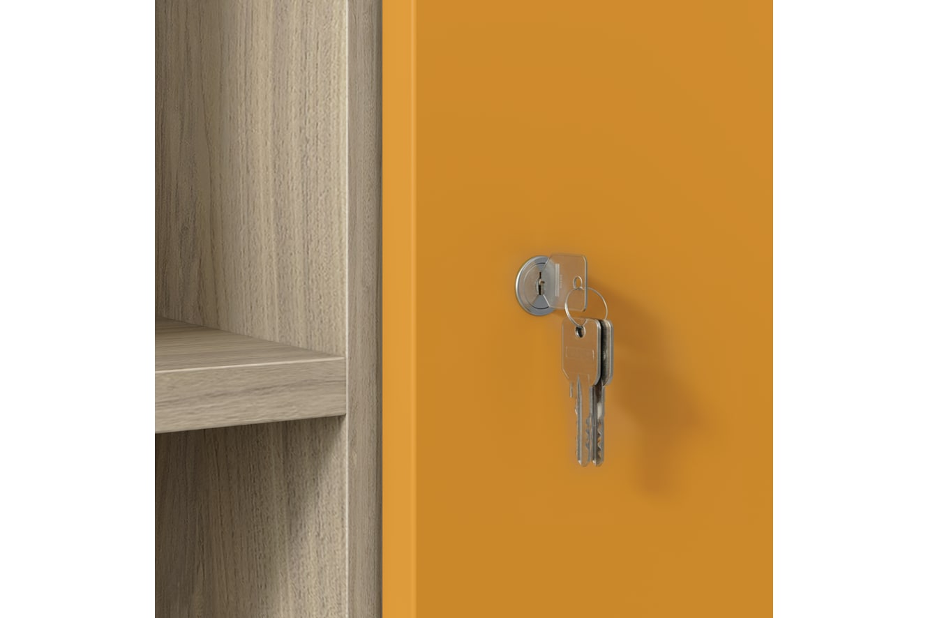 Close-up of silver keys in lock on orange cabinet door with wood shelving.