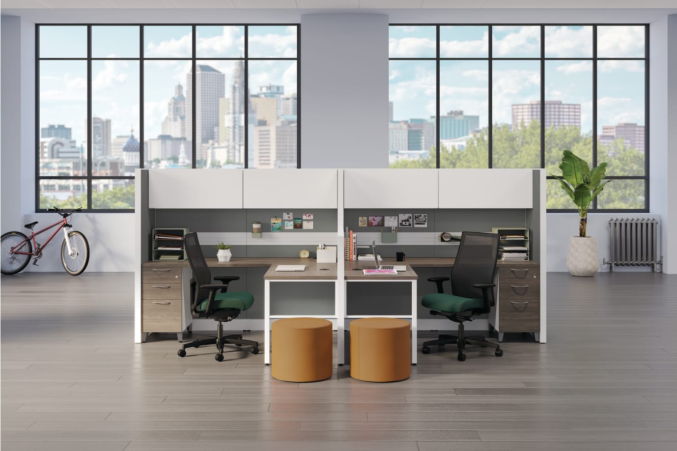Accelerate workstations with Ignition task chairs in green fabric.