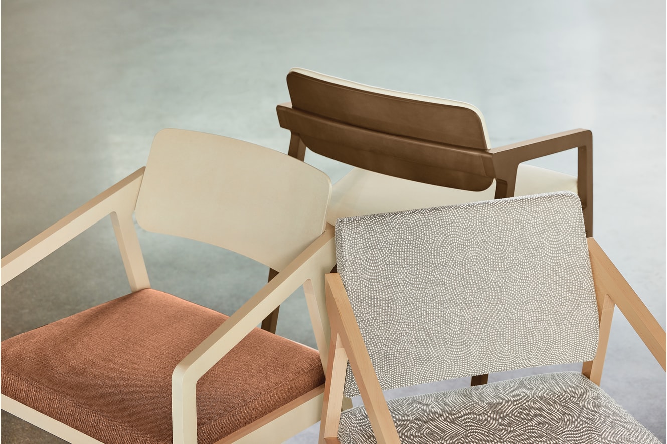 The image features a collection of modern, minimalist chairs in various shades of brown and beige, set against a neutral background.