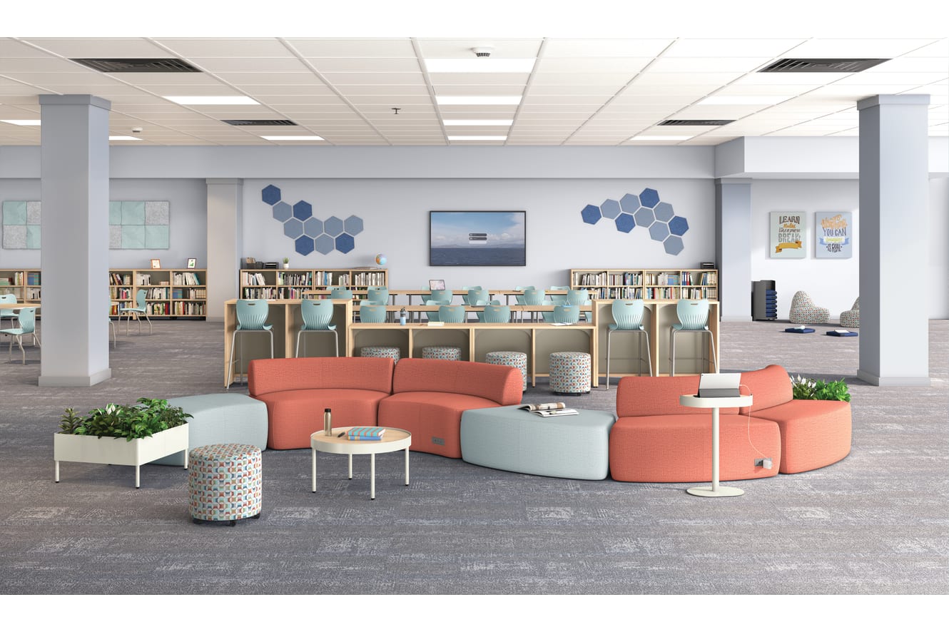 A modern and inviting library or study space with comfortable seating arrangements, bookshelves, and decorative elements in a color palette of blues, grays, and coral.