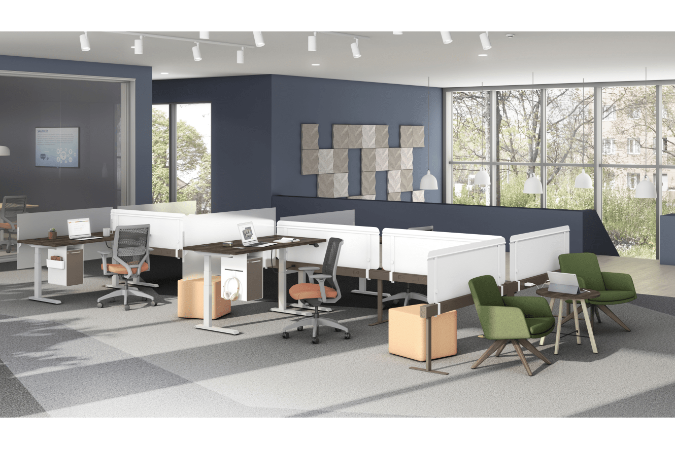 A modern and minimalist office space with workstations, chairs, and large windows overlooking a natural outdoor environment.