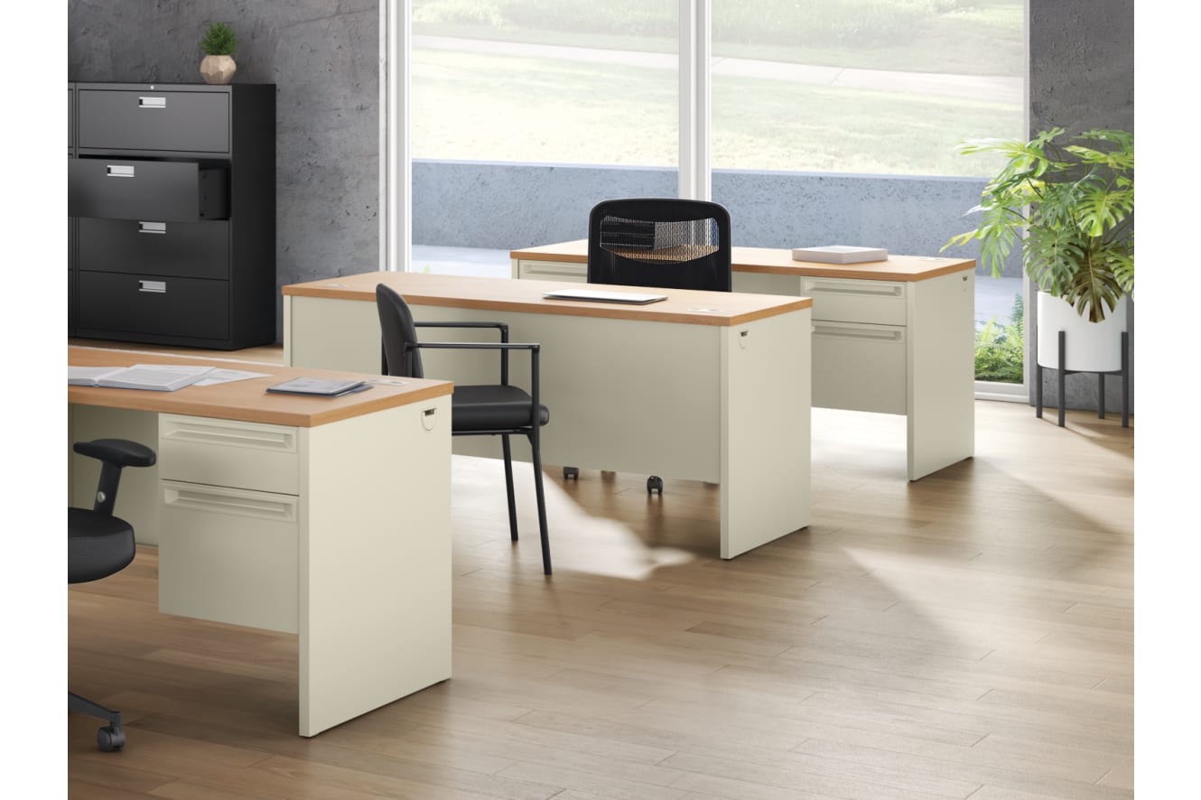 38000 Series Double Ped Desk with Brigade 600 Series Lateral Files, Prominent Mesh Task Chair, Scatter Guest Chair, Between Round Table, and Between Seated-Height Disc Base