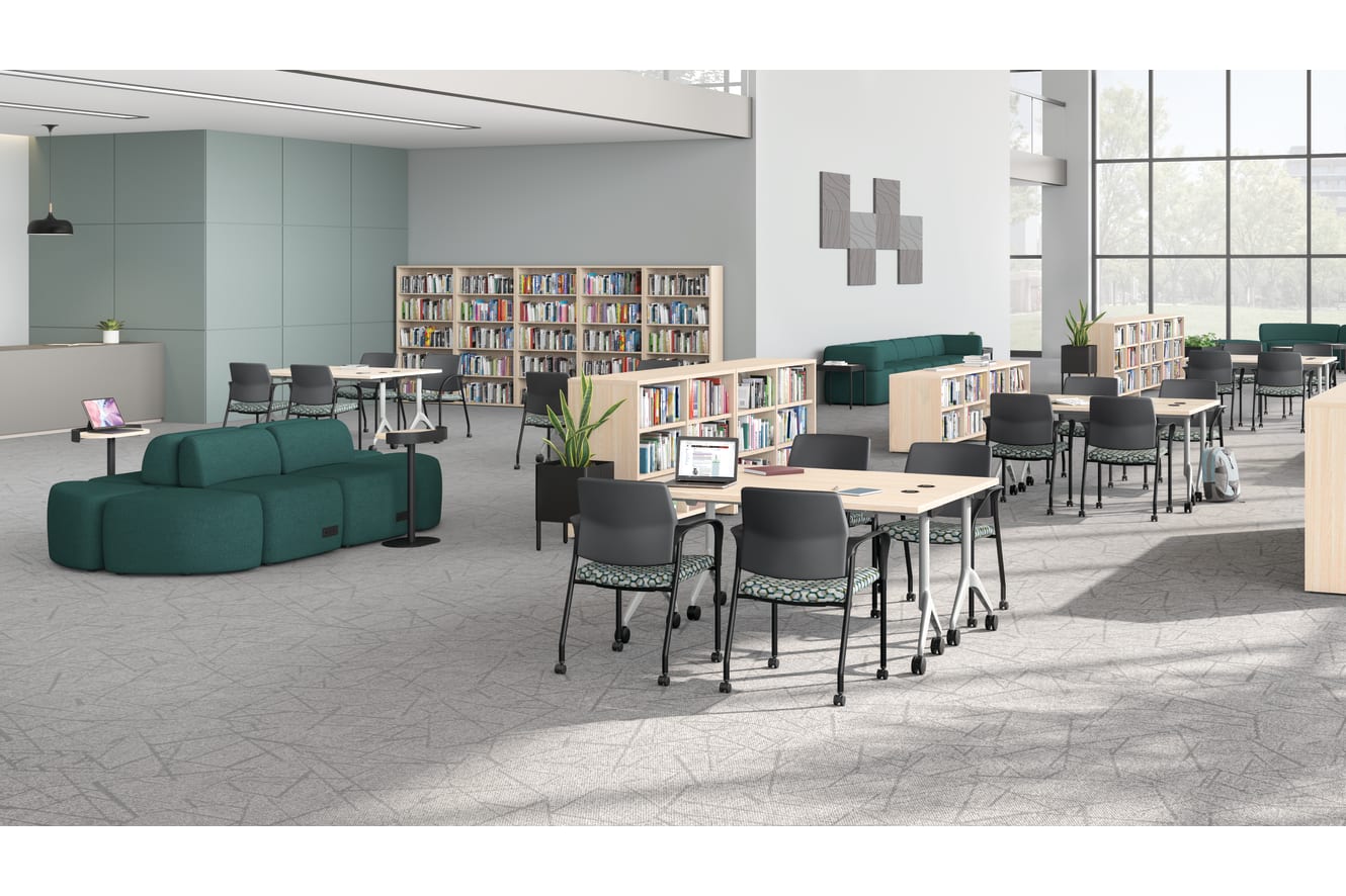 A multi-media center setting featuring SoCo seating, Ignition guest chairs, and Motivate tables.