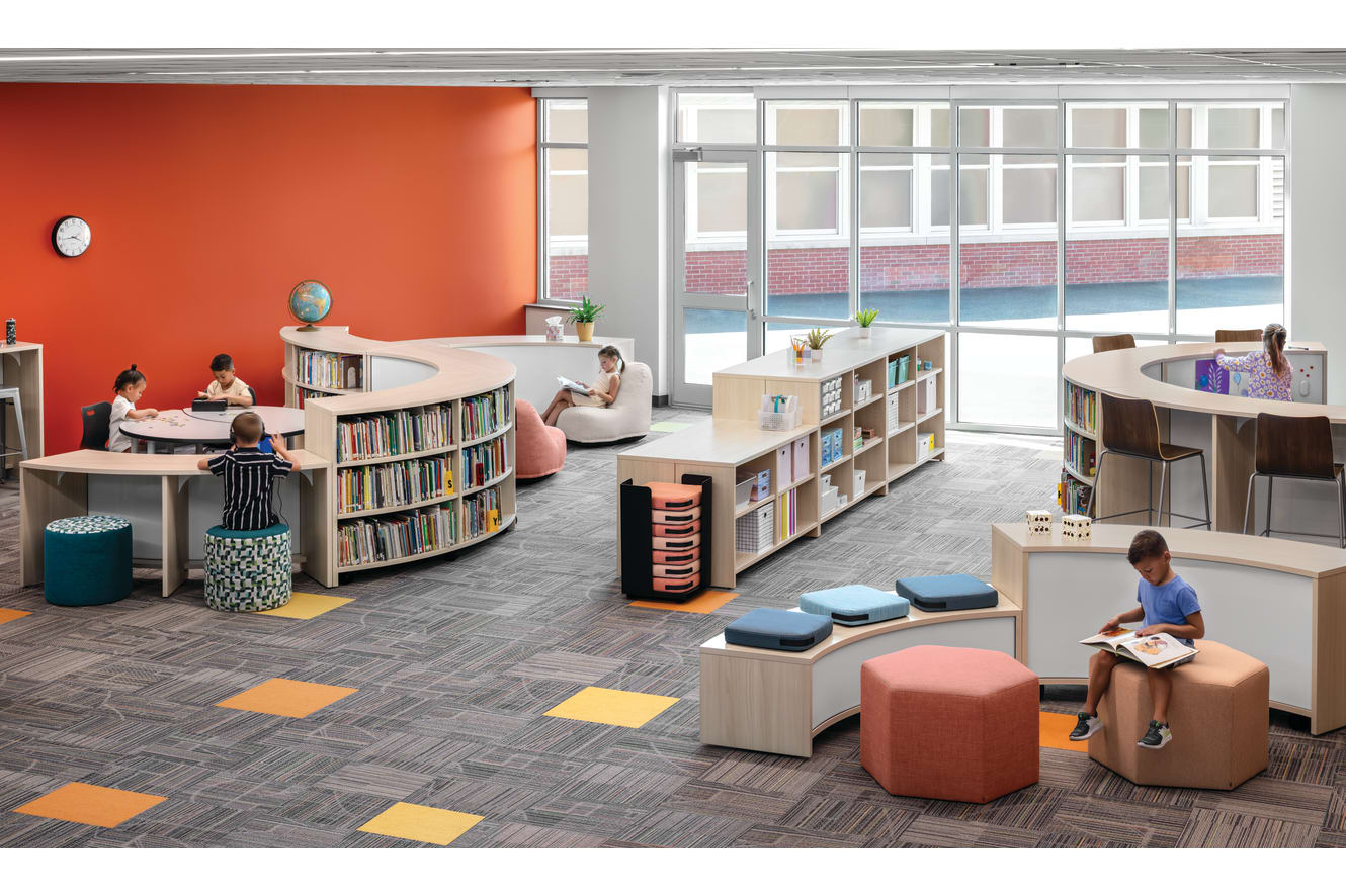 Storyline Bookcases and Bistro Tables with Confetti Floor Cushions and Lounges, Tangram Poufs, and Flock Minis.