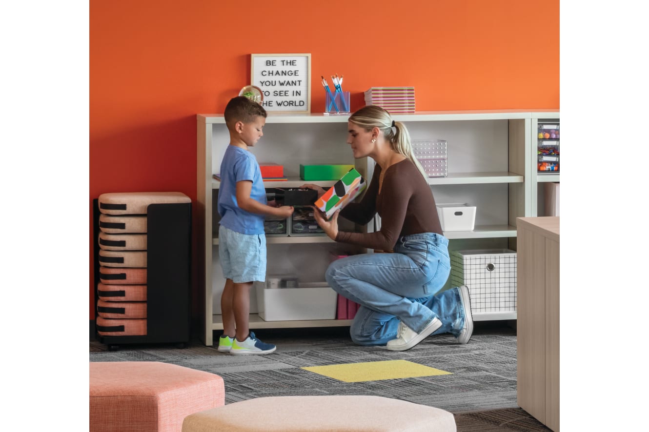 Storyline Linear Bookcases and Bistro Tables with Tangram Poufs and Flock Minis.