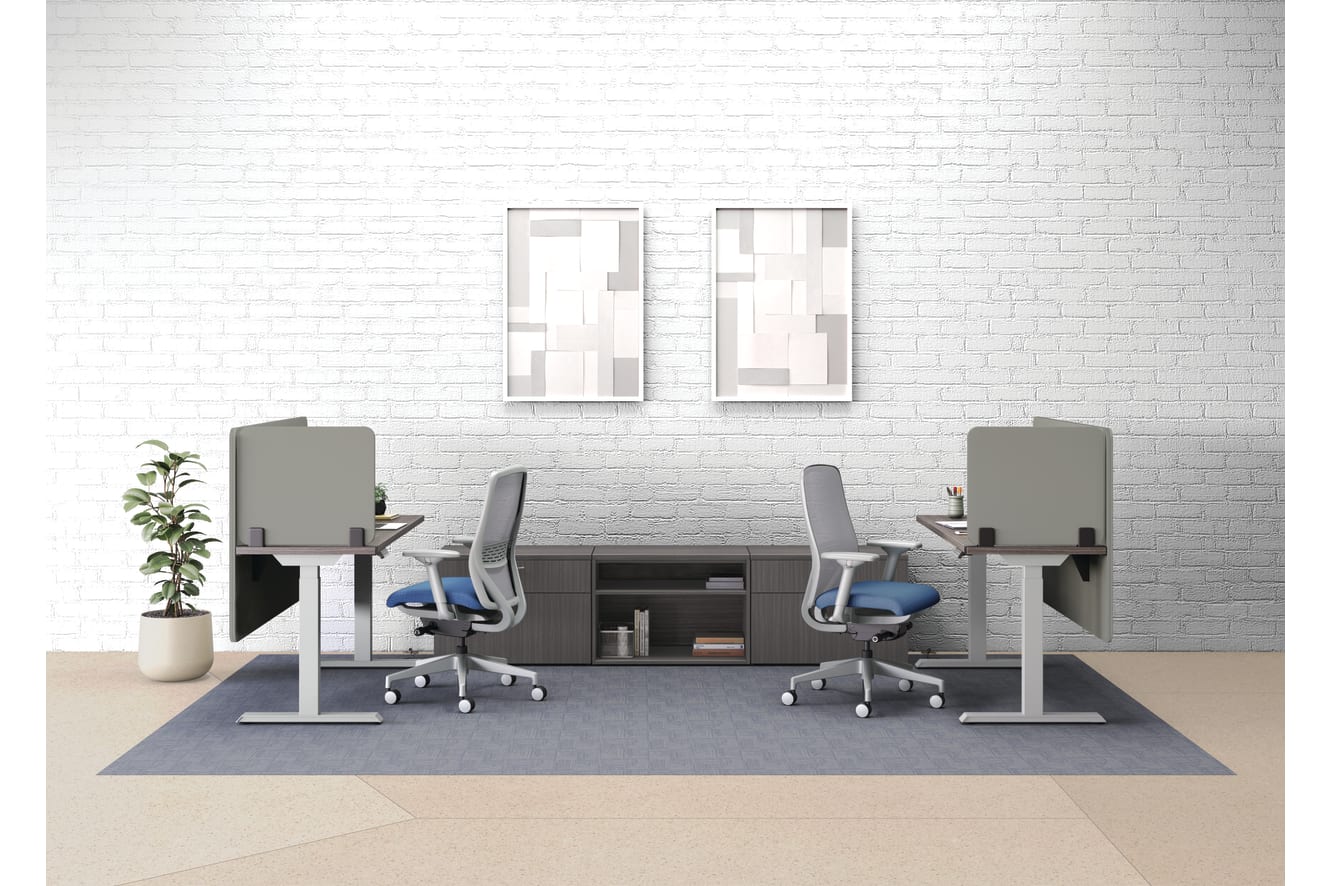 An open plan workstation arrangement with Nucleus task chairs, height-adjustable desks, and Mod storage.