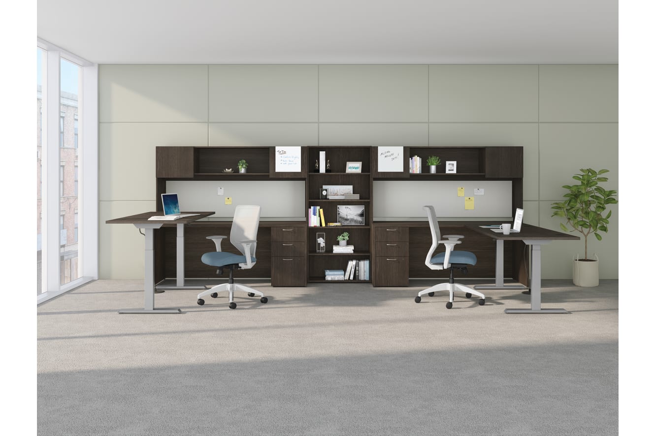 A shared workspace featuring Mod height-adjustable desks and storage components with Solve task seating.