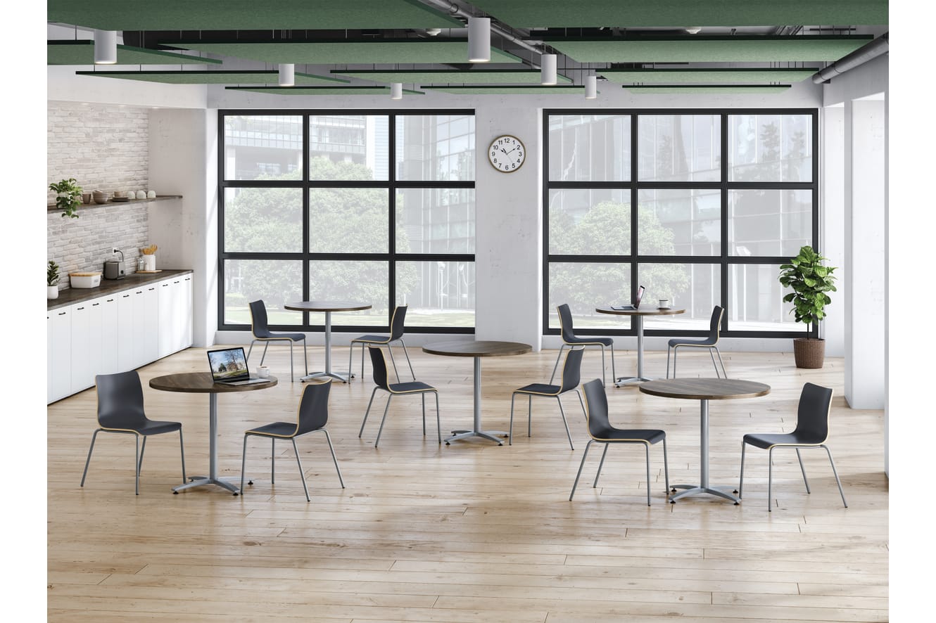 A café setting featuring round Between tables and Ruck wood seating.
