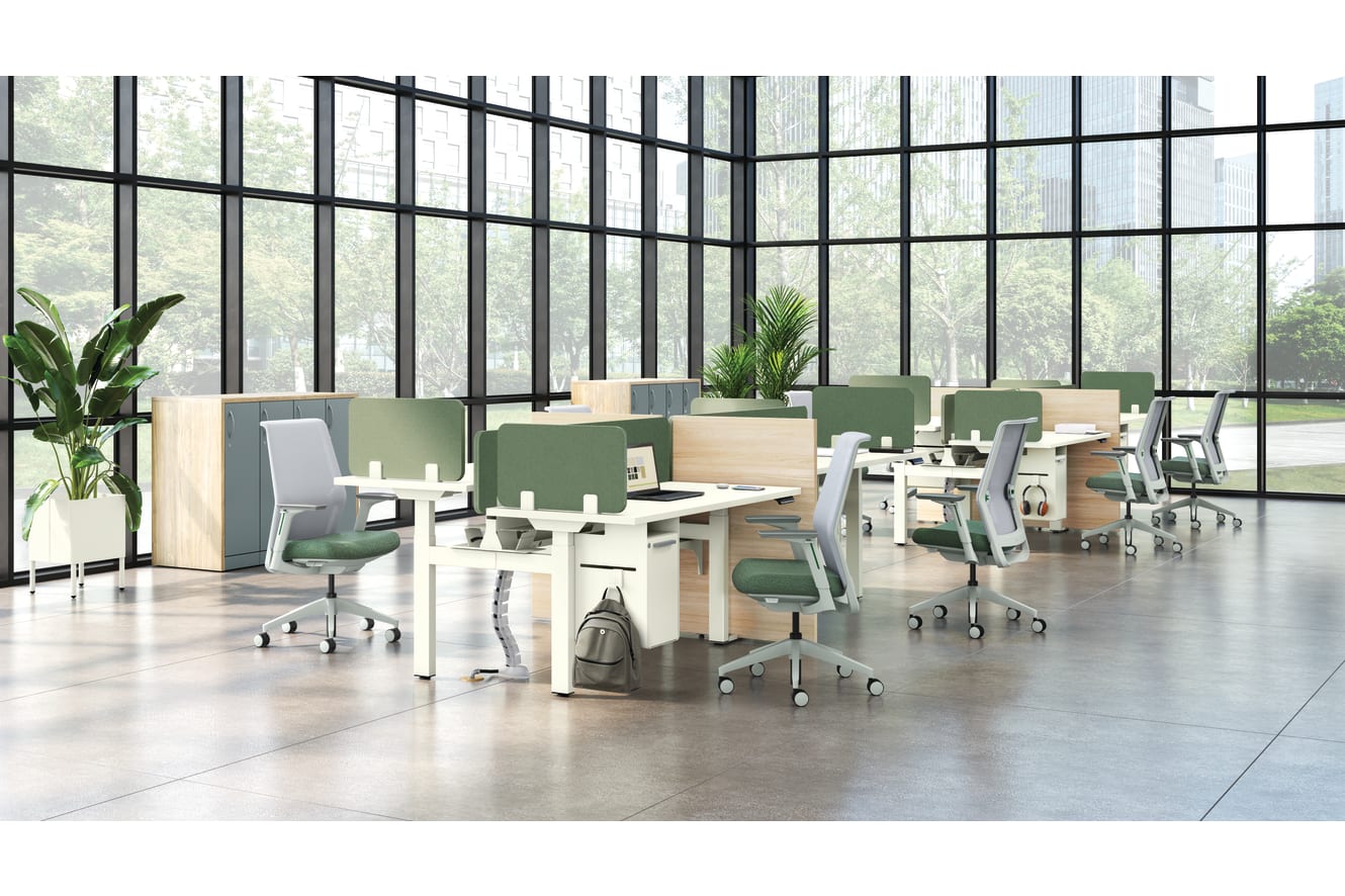 A modern, open-plan office space with large windows overlooking greenery, featuring rows of desks and chairs in a minimalist, neutral color palette.