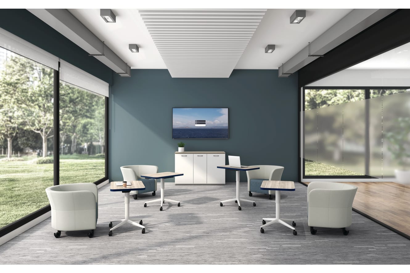 Huddle Laptop Tables with Flock Round Lounge Chairs socially distanced around a conference room.