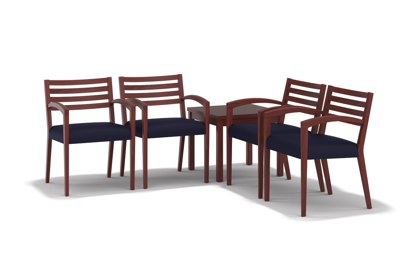 The image shows a set of four wooden chairs with dark blue cushions arranged around a small wooden table.