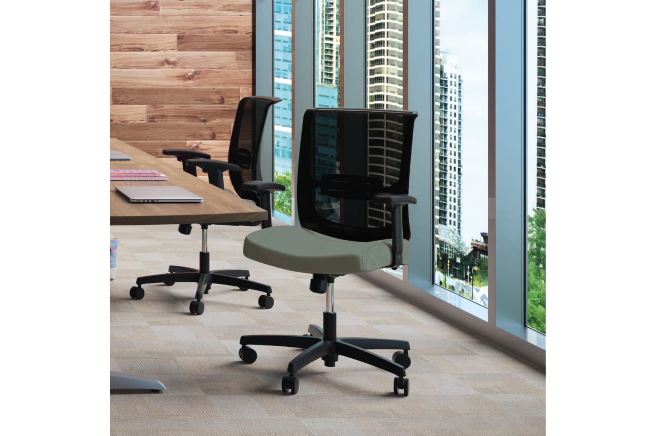 A modern and well-designed office space with wooden wall panels, shelves filled with various items, and a large window overlooking a cityscape.
