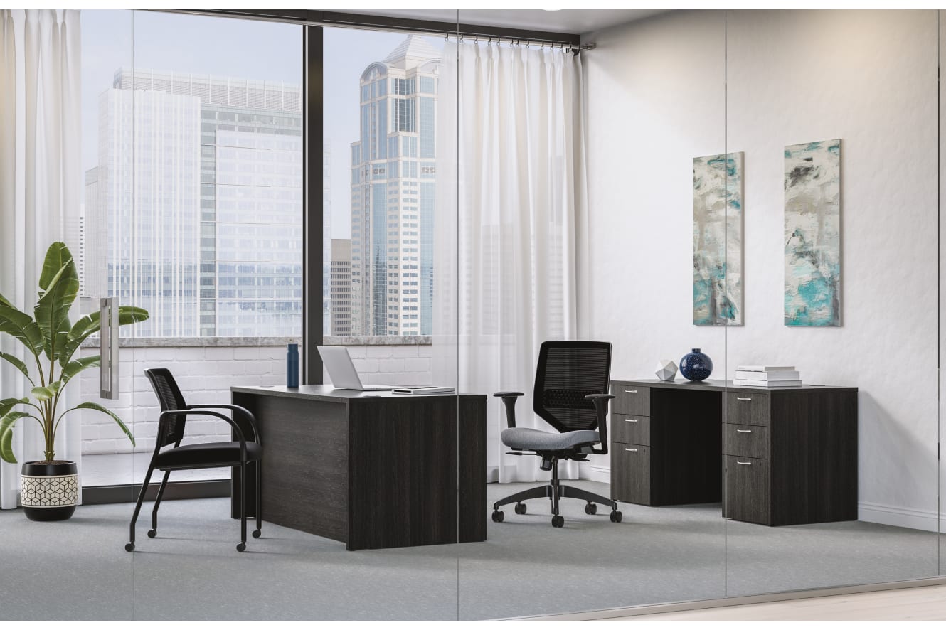 Mod executive desk in Java Oak with Solve task chair and Ignition guest chair