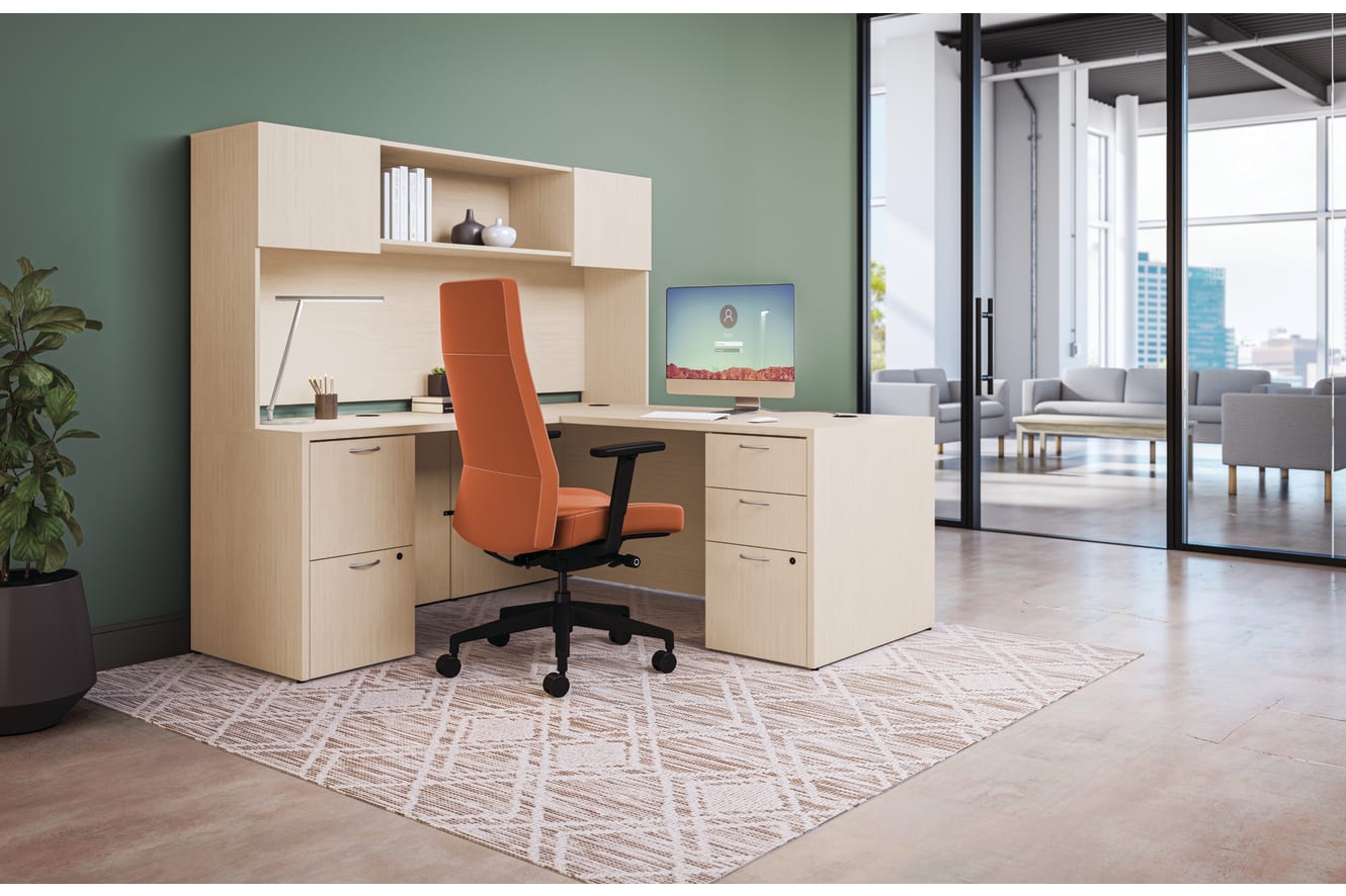 Private office featuring Mod L- shaped desk with high-back Cofi executive chair in orange fabric. 