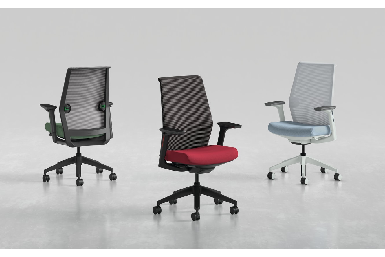 Three modern office chairs with different designs and colors, including black, red, and gray, are displayed on a plain white background.