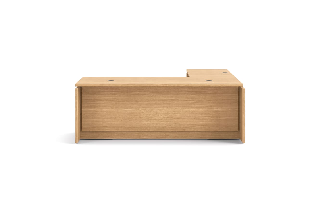 L-shaped executive workstation with woodgrain finish, integrated power access, and pedestal file storage.