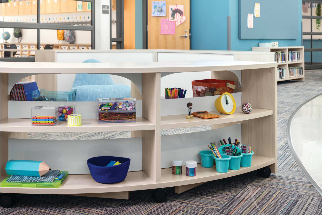 Storyline Bookcases and Bistro Tables with Confetti Floor Lounge.