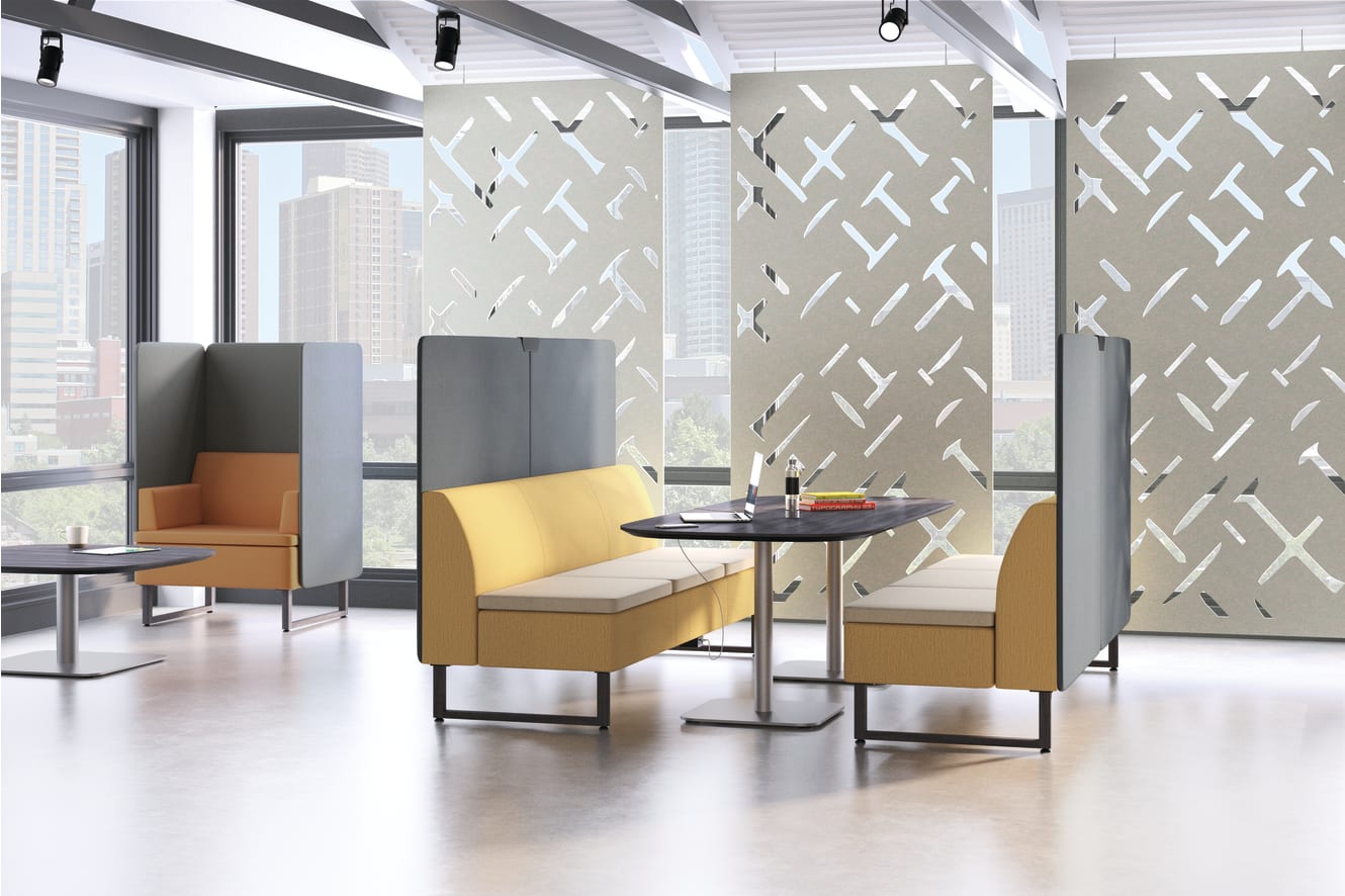 A modern and minimalist office space with yellow and gray furniture, geometric patterns on the walls, and large windows providing natural light.