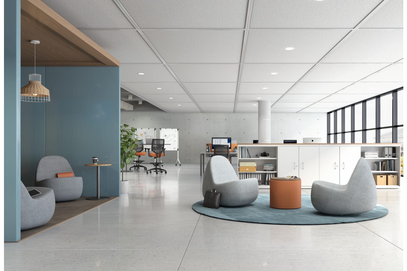 A modern and minimalist office space with comfortable seating areas, workstations, and a clean, organized layout.